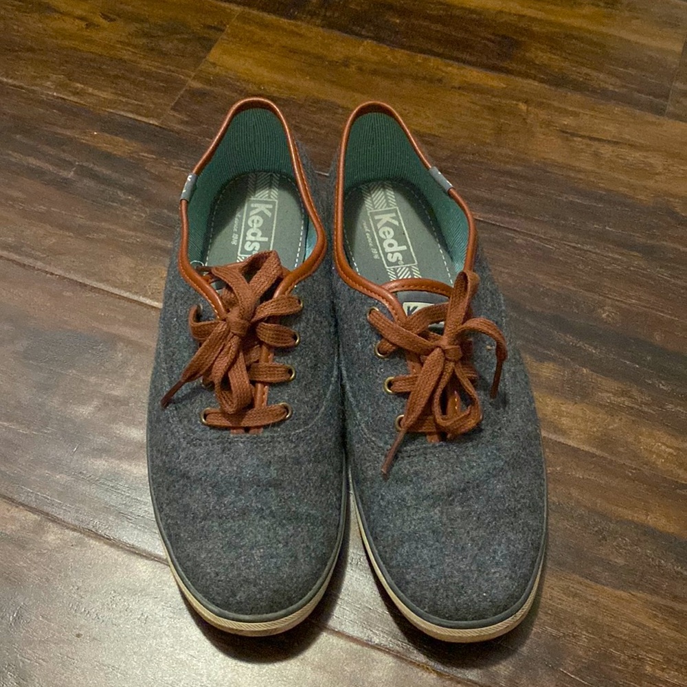 Keds, size 9 1/2. Gray with brown leather trim. Has both brown and gray laces.